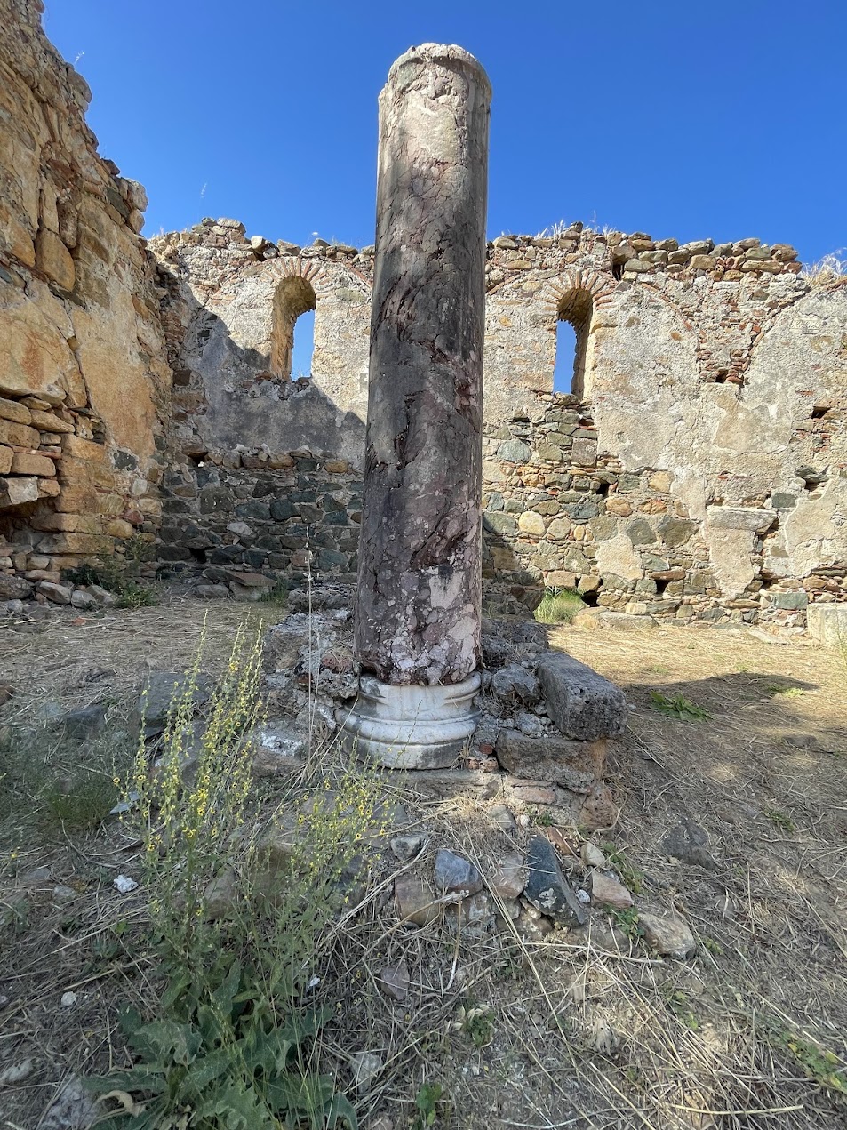 The red marble column — spolium from the 5th-century basilica